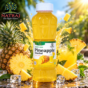 Chilled glass of refreshing pineapple sharbat summer drink with ice and mint